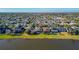 Aerial view of a beautiful home located on the water's edge at 14637 Tanja King Blvd, Orlando, FL 32828