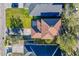 Birds eye view of the brown-roofed house, nestled among its neighbors with well-maintained green lawns at 14637 Tanja King Blvd, Orlando, FL 32828