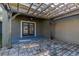 Outdoor covered patio featuring a brick paver area with pergola at 14637 Tanja King Blvd, Orlando, FL 32828
