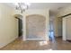 Elegant dining area with tile floors, stylish light fixture, and decorative stone accent wall at 14637 Tanja King Blvd, Orlando, FL 32828