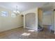 Bright dining room with large windows, tiled floors, and a decorative chandelier at 14637 Tanja King Blvd, Orlando, FL 32828