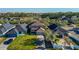 Exterior shot of the house with well-maintained lawn in a quiet neighborhood near a body of water at 14637 Tanja King Blvd, Orlando, FL 32828