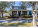 Beautiful two-story home featuring a classic design, covered porch, and professionally landscaped yard at 14637 Tanja King Blvd, Orlando, FL 32828