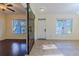 Welcoming foyer featuring neutral paint, ceramic tile flooring and a modern sliding barn door for the adjacent room at 14637 Tanja King Blvd, Orlando, FL 32828