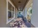 Spacious covered front porch with stylish lighting and a view of the neighborhood at 14637 Tanja King Blvd, Orlando, FL 32828