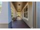Inviting covered front porch featuring sturdy columns and pleasant outdoor ambiance at 14637 Tanja King Blvd, Orlando, FL 32828
