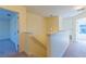 Bright hallway on the upper level with entrances to different rooms and stairs at 14637 Tanja King Blvd, Orlando, FL 32828