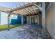 Private outdoor patio area with a pergola and brick pavers, perfect for relaxing or entertaining at 14637 Tanja King Blvd, Orlando, FL 32828