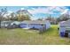 Aerial view of the fenced backyard featuring a patio and the blue exterior of the home at 1507 Georgia Ave, St Cloud, FL 34769