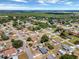Overhead view of a tranquil residential area featuring tidy homes and tree-lined streets at 152 Harrison St, Lake Wales, FL 33859