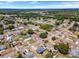 Picturesque aerial shot of a charming neighborhood with well-maintained homes and lush landscaping at 152 Harrison St, Lake Wales, FL 33859
