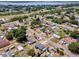 Aerial neighborhood view showcasing the house, nearby homes, and streets at 152 Harrison St, Lake Wales, FL 33859