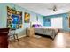 Bedroom featuring unique decor, wood-look floors, and a ceiling fan at 152 Harrison St, Lake Wales, FL 33859