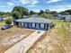 Charming single-story home with a well-maintained front yard, long driveway, and neutral paint at 152 Harrison St, Lake Wales, FL 33859