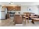 Kitchen with stainless steel appliances and an island with seating at 152 Harrison St, Lake Wales, FL 33859