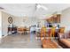 Open-concept kitchen and dining area with wood cabinets and a breakfast bar at 152 Harrison St, Lake Wales, FL 33859