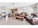 Open concept living room with modern floors that flows to the kitchen island at 152 Harrison St, Lake Wales, FL 33859