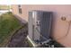 Air conditioning unit located on a concrete slab at 156 Grand Canal Dr, Poinciana, FL 34759