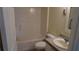 This bathroom features a vanity with granite countertops and a shower over tub at 156 Grand Canal Dr, Poinciana, FL 34759