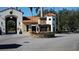 The community entrance features the Stonegate Golf Club sign and beautiful landscaping at 156 Grand Canal Dr, Poinciana, FL 34759