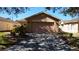 Single story home with a large two car garage and brick paver driveway at 156 Grand Canal Dr, Poinciana, FL 34759