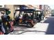The community features golf carts parked in a row on the street at 156 Grand Canal Dr, Poinciana, FL 34759