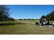 This community features a golf course, a golf cart, and a serene landscape at 156 Grand Canal Dr, Poinciana, FL 34759