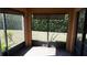 Screened lanai with tile floors and views of the backyard at 156 Grand Canal Dr, Poinciana, FL 34759