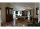 Spacious living room with tile floors, ceiling fan, large windows, and sliding glass doors to the lanai at 156 Grand Canal Dr, Poinciana, FL 34759