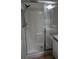 This bathroom features a walk-in shower with glass doors and an adjustable shower head at 156 Grand Canal Dr, Poinciana, FL 34759