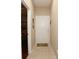 Hallway features tile floor and a white front door at 185 Club Villas Ln, Kissimmee, FL 34744