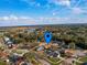 An aerial view of the neighborhood showcasing the proximity to nearby homes, and lush landscaping at 206 Memphis Pl, St Cloud, FL 34769