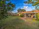 Backyard featuring a spacious lawn and a screened patio at 206 Memphis Pl, St Cloud, FL 34769