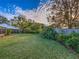 Large backyard with green grass and mature trees at 206 Memphis Pl, St Cloud, FL 34769