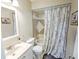 Bathroom featuring a vanity sink, toilet and shower/tub combo at 206 Memphis Pl, St Cloud, FL 34769