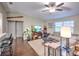 Open-concept living room with modern decor, hardwood floors, and plenty of natural light at 206 Memphis Pl, St Cloud, FL 34769