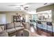 Inviting living room showcases an open floor plan, bar seating, and comfortable gray couch at 206 Memphis Pl, St Cloud, FL 34769