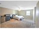Serene bedroom featuring plush carpeting, ample natural light, and a calming neutral color palette at 206 Memphis Pl, St Cloud, FL 34769
