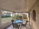A screened-in patio with tile flooring, outdoor seating, and a view of the backyard and garden at 206 Memphis Pl, St Cloud, FL 34769