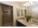Bathroom with double sinks, granite countertop, and shower at 2112 Morocco Way, Kissimmee, FL 34747