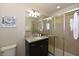 Bathroom with single sink, granite countertop, and shower at 2112 Morocco Way, Kissimmee, FL 34747