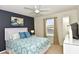 Spacious bedroom with a queen-size bed and TV at 2112 Morocco Way, Kissimmee, FL 34747