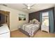 Bedroom with a full-size bed, nightstand, and TV at 2112 Morocco Way, Kissimmee, FL 34747