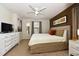 Spacious Primary bedroom with king-size bed and en-suite bathroom at 2112 Morocco Way, Kissimmee, FL 34747