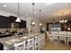 Open kitchen with large island, granite counters, and stainless steel appliances at 2112 Morocco Way, Kissimmee, FL 34747