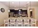 Island kitchen with granite countertops and stainless steel appliances at 2112 Morocco Way, Kissimmee, FL 34747