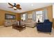 Bright living room featuring two sofas, a coffee table, and a comfortable armchair at 2112 Morocco Way, Kissimmee, FL 34747