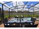 Enjoy alfresco dining by the pool with seating for six at 2112 Morocco Way, Kissimmee, FL 34747