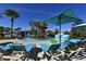 Community resort-style pool with lounge chairs and umbrellas at 2112 Morocco Way, Kissimmee, FL 34747
