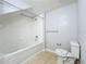 Bathroom features a tub/shower, tiled walls, and a tiled floor at 2203 San Vittorino Cir # 107, Kissimmee, FL 34741